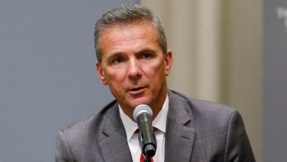 Texas Fans Notice Something Behind Urban Meyer During Interview (Photo)