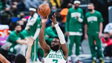 Jaylen Brown in a Boston Celtics uniform shooting a basketball